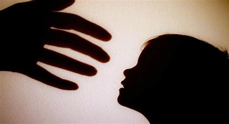 shadowed open hand to child face